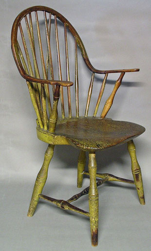 A Brace Back Continuous Arm Windsor Chair in Old Yellow Paint