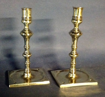A Pair of Early Bold Saucer Base Candlesticks